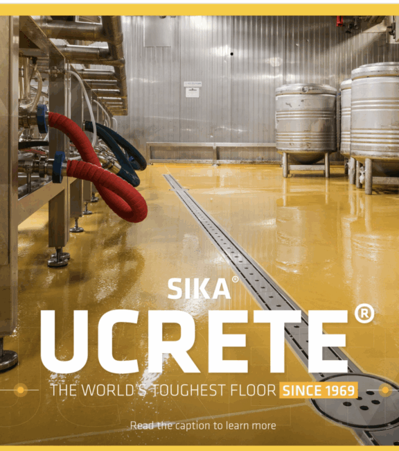 Pardoseală poliuretanică industrială galbenă Ucrete într-o fabrică de procesare cu tancuri din inox